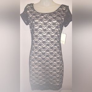 FIT Figure Improving Technology form fitting lace over nude underlay dress